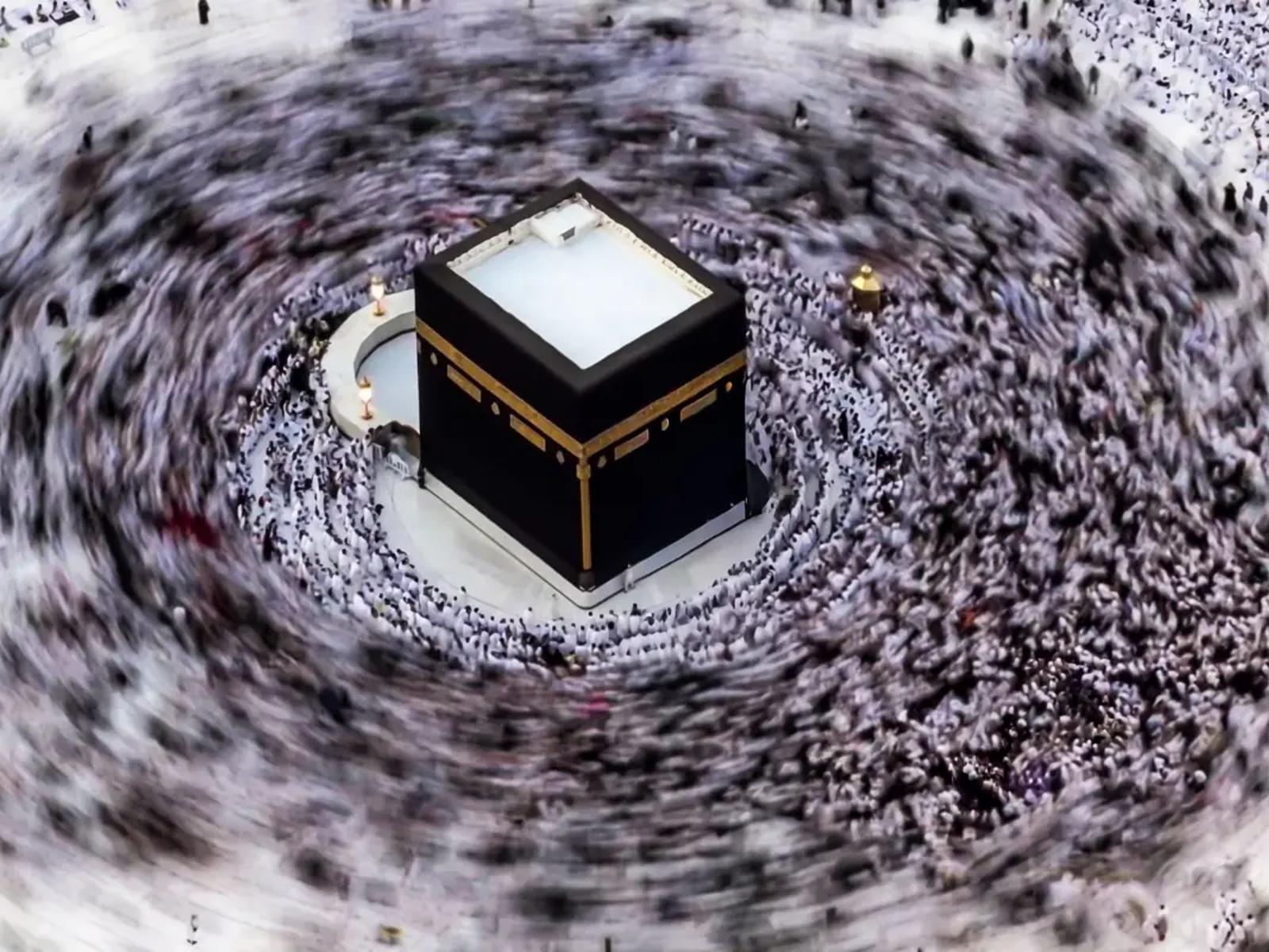 The Kaaba seen from above, with the pilgrims circling it blurred by a long exposure